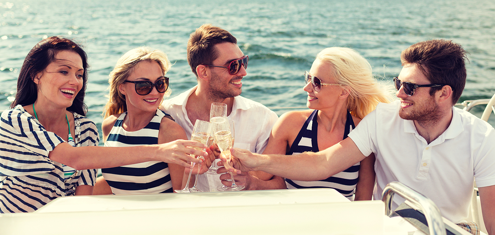 Two Couples on the Stern of the Yacht Enjoying Brunch